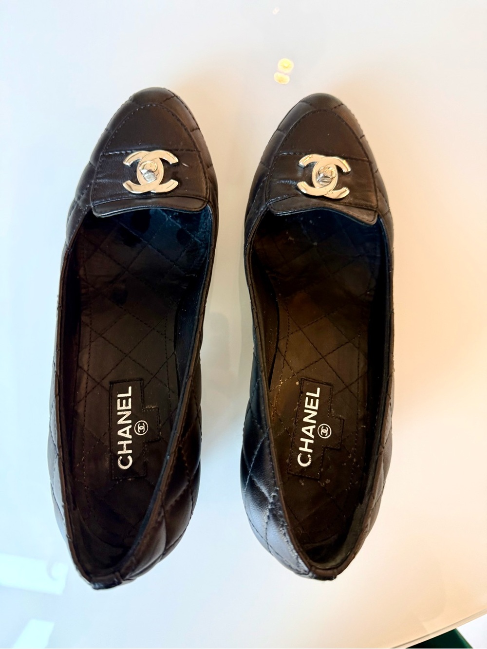 CHANEL Black Quilted Leather CC Cap-Toe Flats with Silver Logo